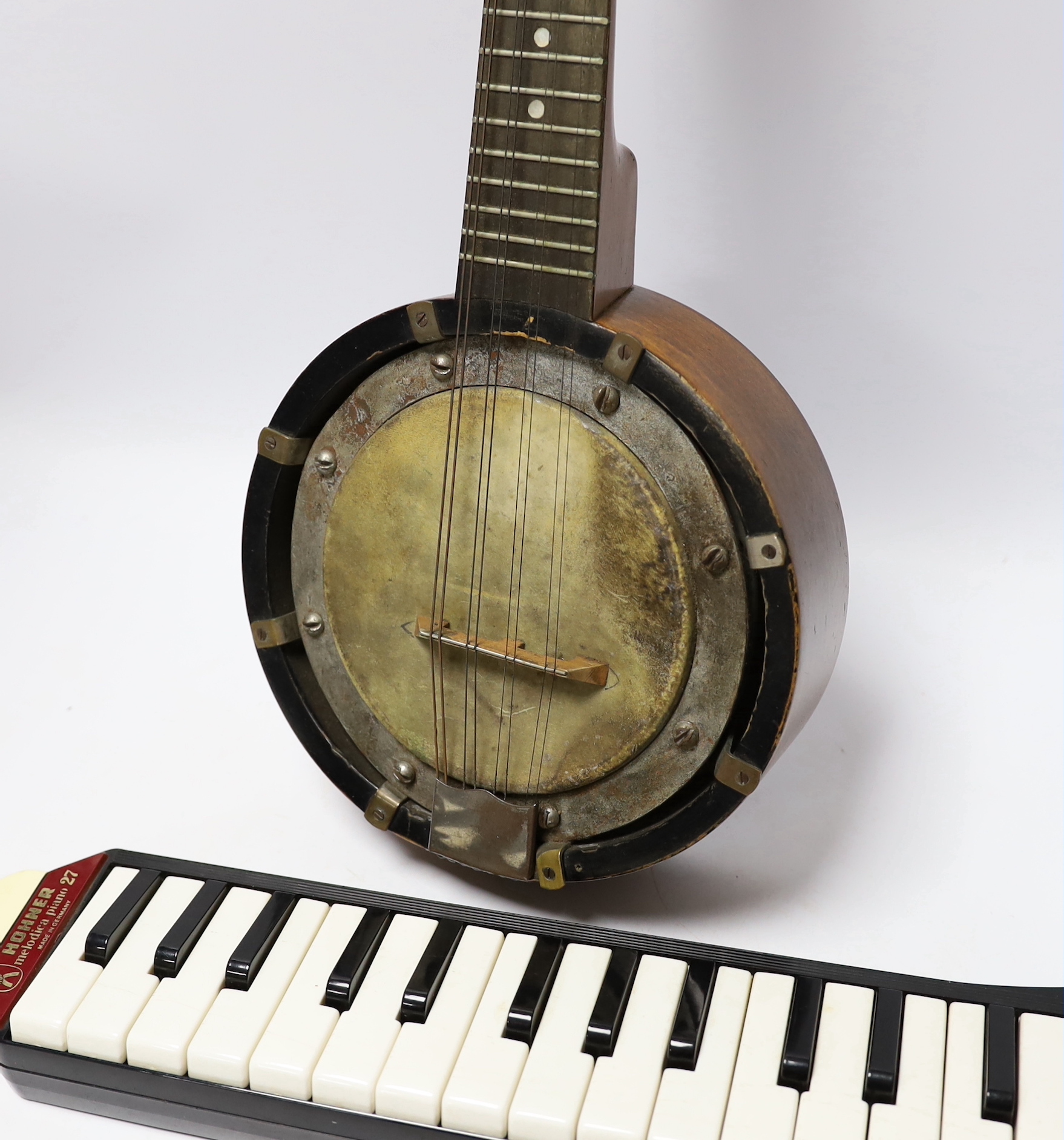A John Grey and sons, London eight string banjolele in original case and a Hohner melodica